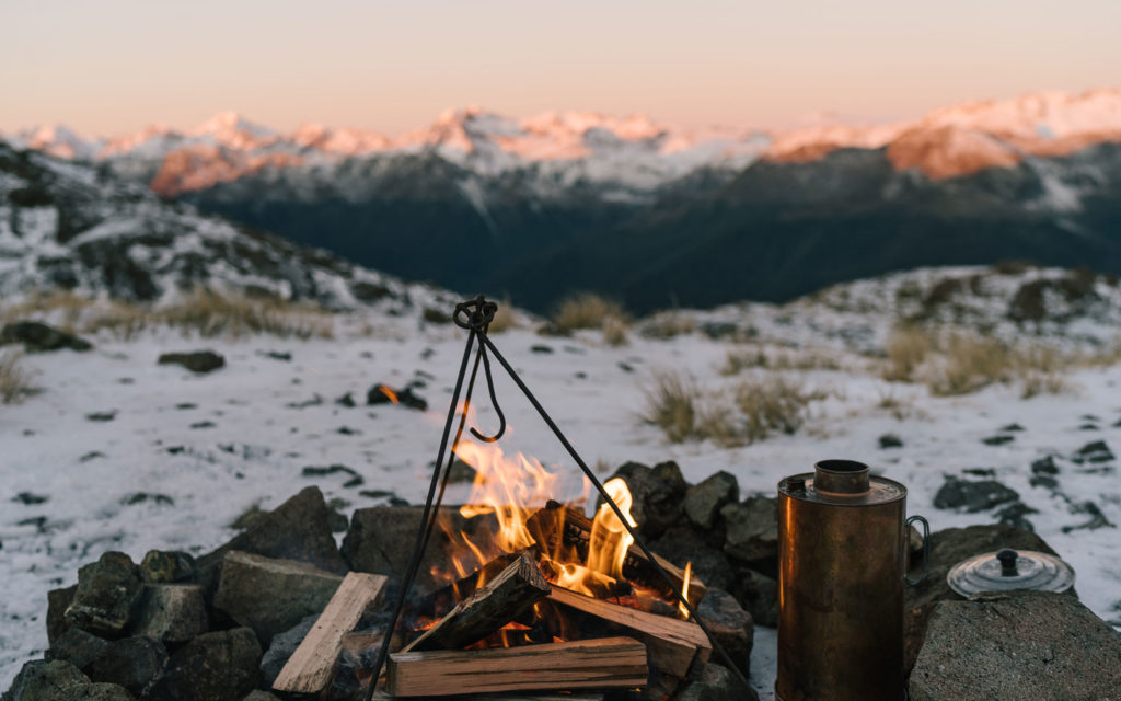 Outdoor fire in the snowy mountains - The Great Glenorchy Alpine Base Camp