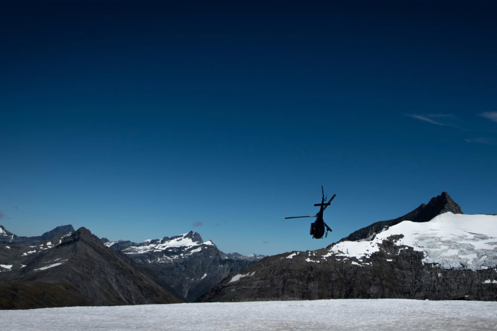 Helicopter leaving the glacier