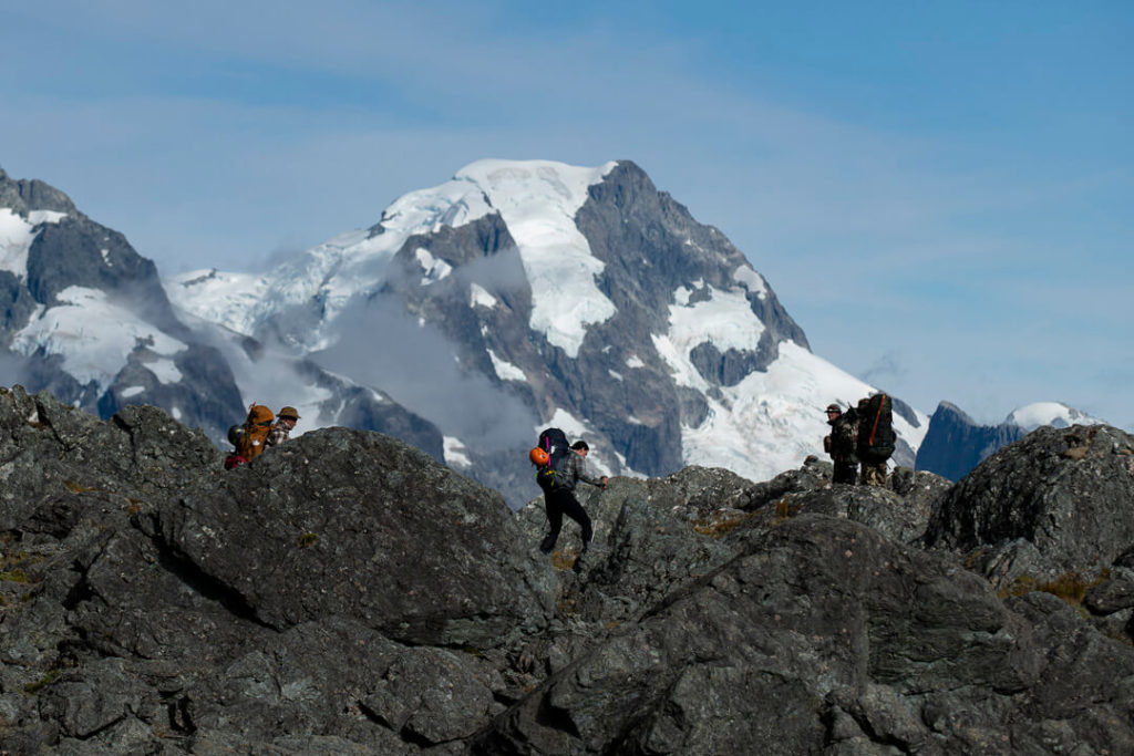 Mountain in background, climbers in foreground.
