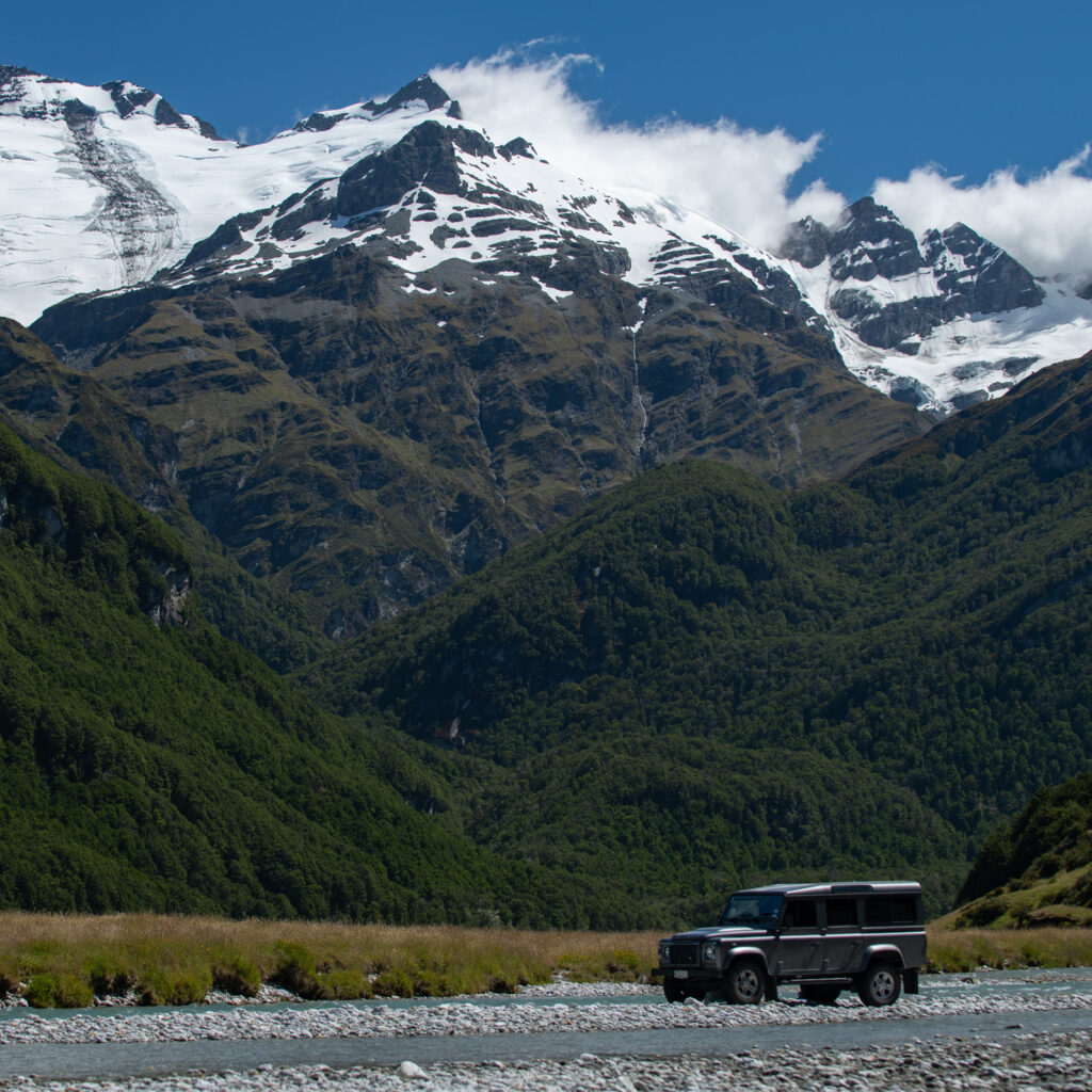Land Rover Defender sitting on the side of the Rees Valley River.